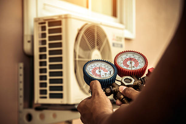 Professional Air Conditioning Service technician working in Green River, UT